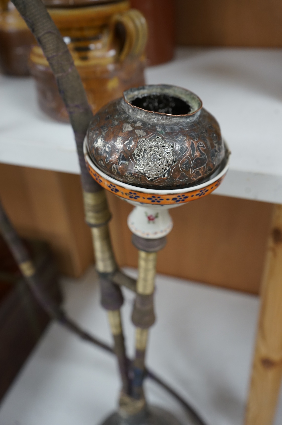 A modified silver plate, copper and porcelain hookah, 65cm